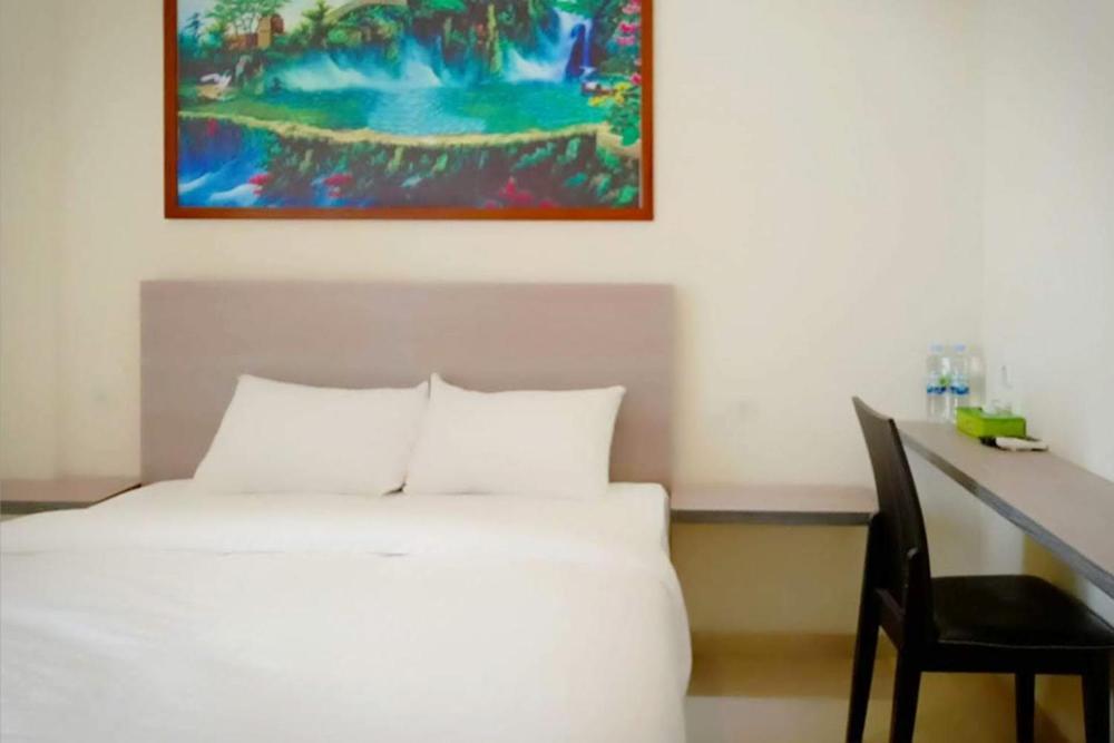 Twospaces Living At Maximus Inn Palembang Exterior foto